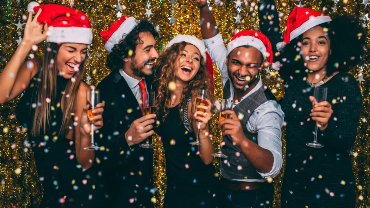 christmas party Corporate guests dressed up and enjoying chammpagne and laugher at their office ChristmasParty