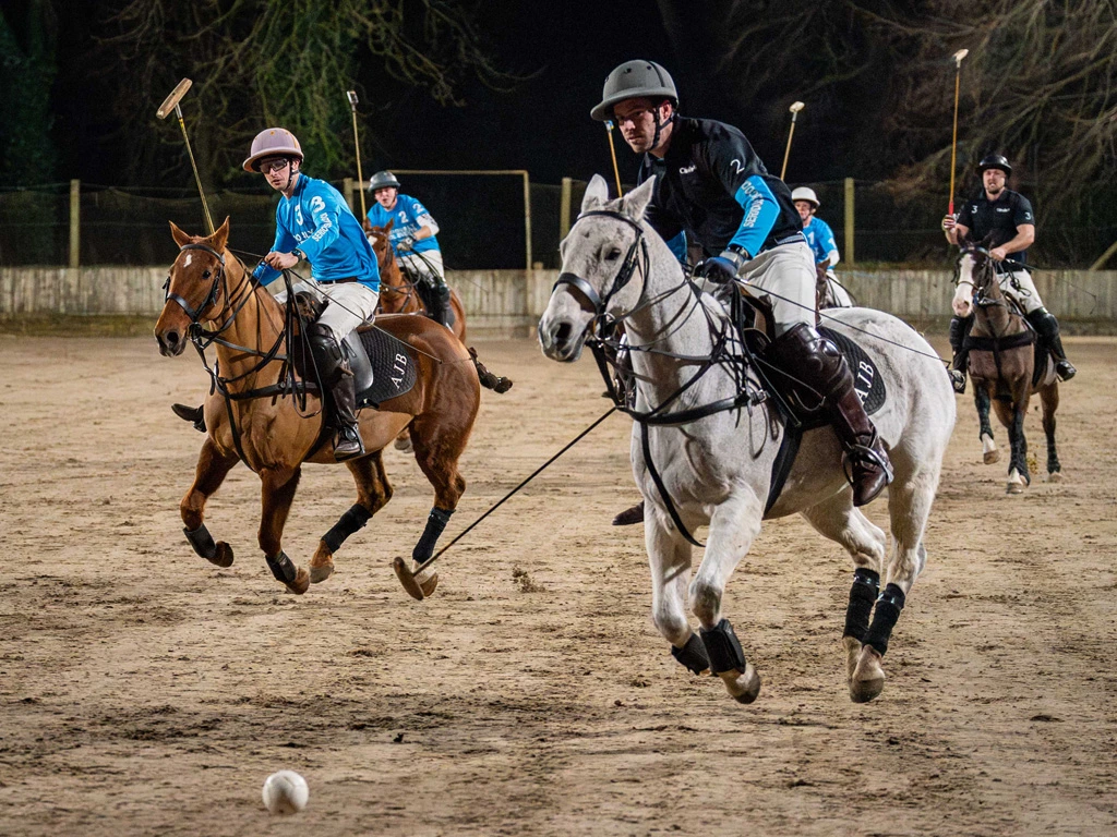 Fireside-polo-party-action Fireside Polo action with Maurice Ormerod charging for goal